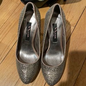 Nina pink/silver glitter heels. Hidden platform. Worn a few times. Size 6.
